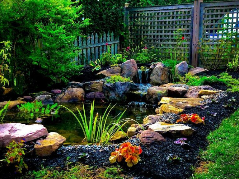 Water Features in Moore, OK being installed beside a patio with stone edging