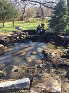 Cleaning_a_pond_in_Edmond