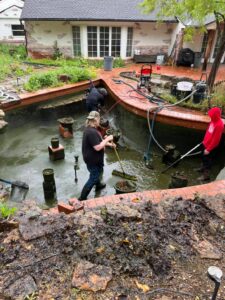 Cleaning_out_a_formal_water_feature_in_Nichols_Hills