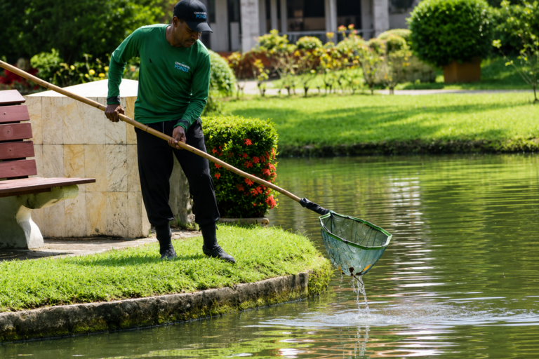 Service-tech-providing-pond-maintenance
